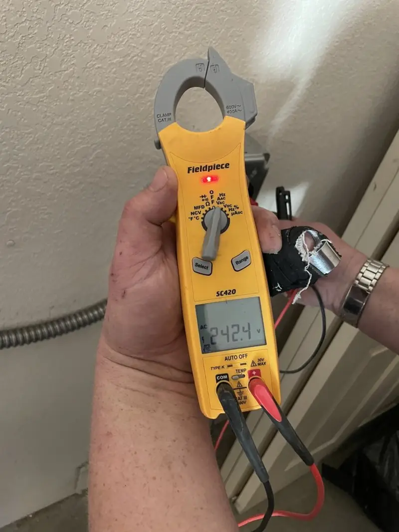 Voltage testing with clamp meter during Electrical Installation Services in Altavista